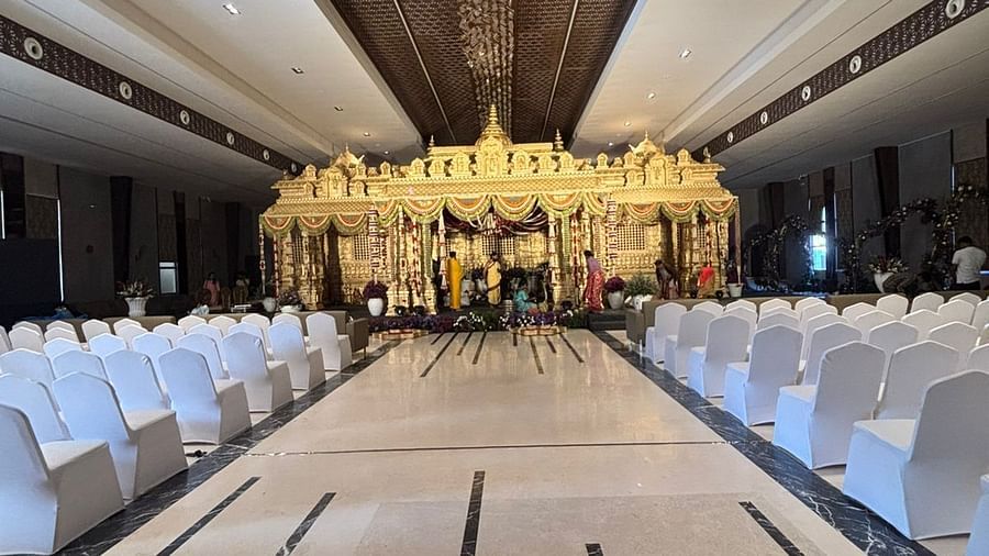 Grand wedding stage with floral decor and chandeliers.  | VRR Astoria Hotel and Conventional Centre