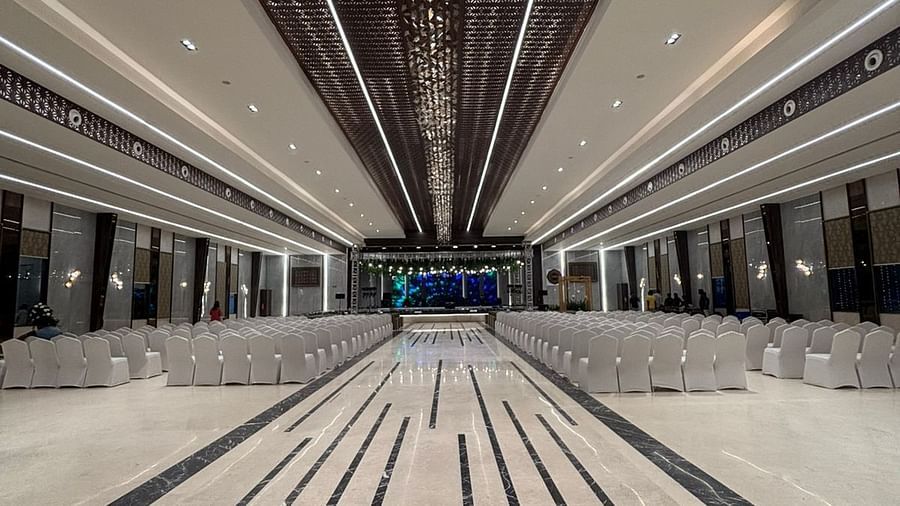 Spacious Banquet Hall with Elegant Lighting and Striped Flooring - VRR Astoria Hotel and Conventional Centre