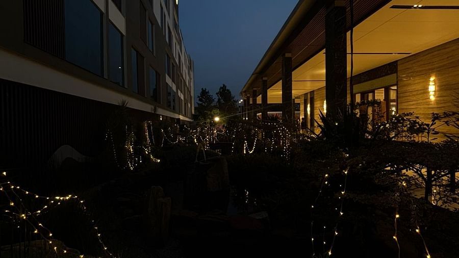 Ambient Outdoor Space with Trees, Warm Lighting, and Night View - VRR Astoria Hotel and Conventional Centre
