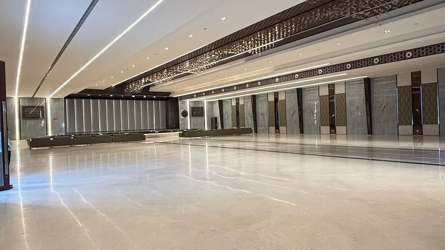 Elegant hall with intricate ceiling design and marble flooring