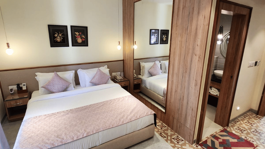 Spacious Super Deluxe Room with a comfortable bed, contemporary furnishings and warm interiors at Hotel Southgate Goa, Calangute, designed for a relaxing stay.