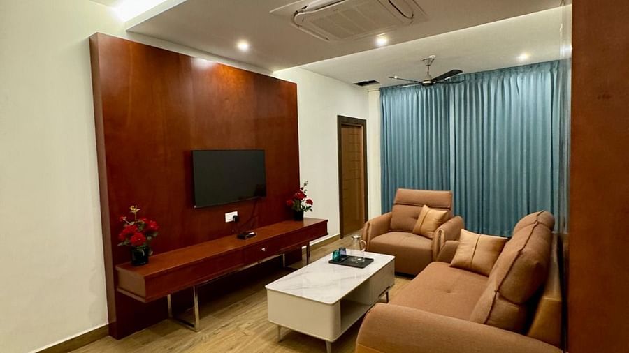Image of a seating area with sofas and a television in front  at Le Royale Palace.