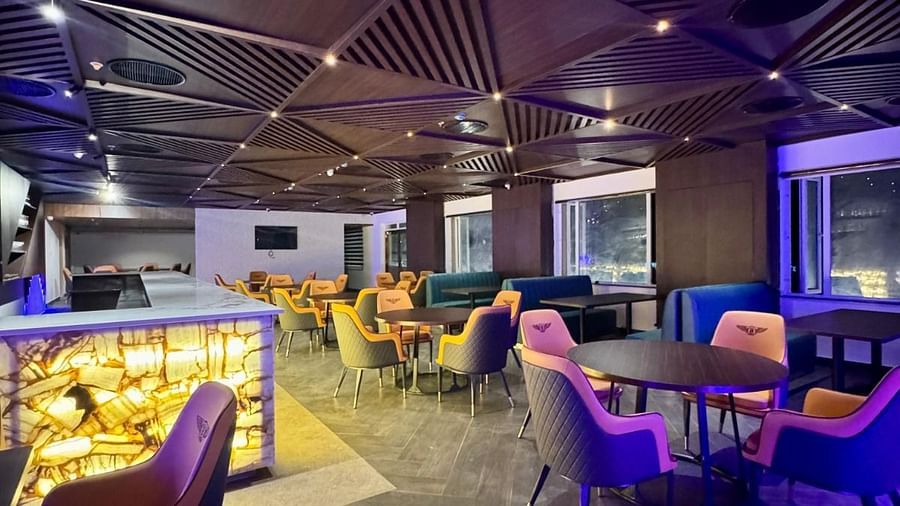 Image of Crown Bar with seating area and wooden ceiling at Le Royale Palace.