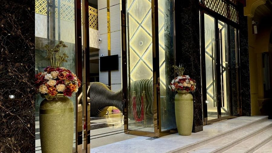 Image of open glass doors with a staircase leading to it at Le Royale Palace.