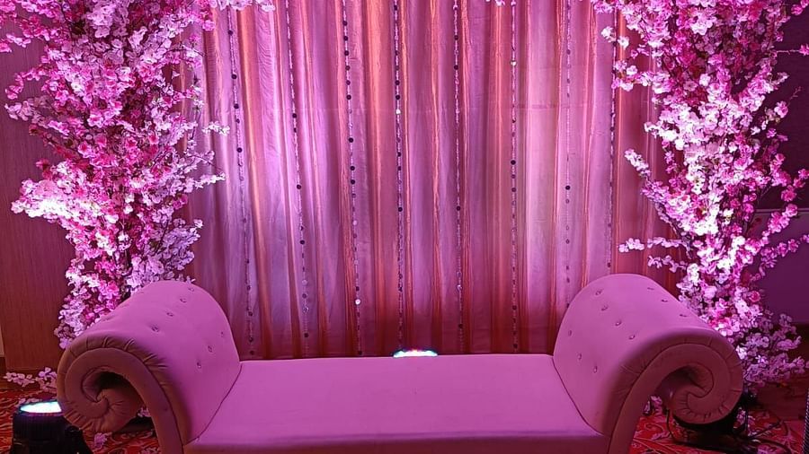 Image of a stage with sofa and dim lights at The Oriental Residency