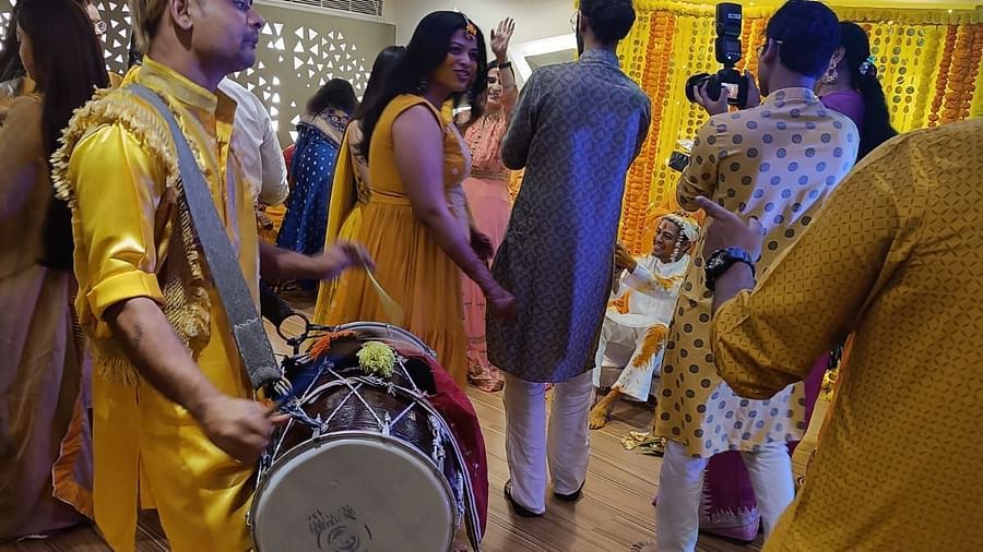 Image of  a group of people dacncing with a man playing a traditional drum at The Oriental Residency