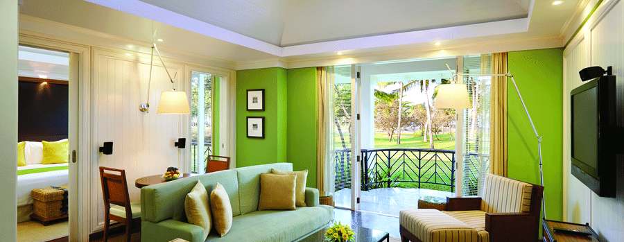 overview of the living room with sofas and table inside Presidential Villa - Caravela Beach Resort Goa