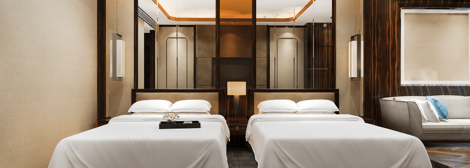 A spacious room featuring a twin bed, elegant lighting, wooden panelling, and contemporary interior design.