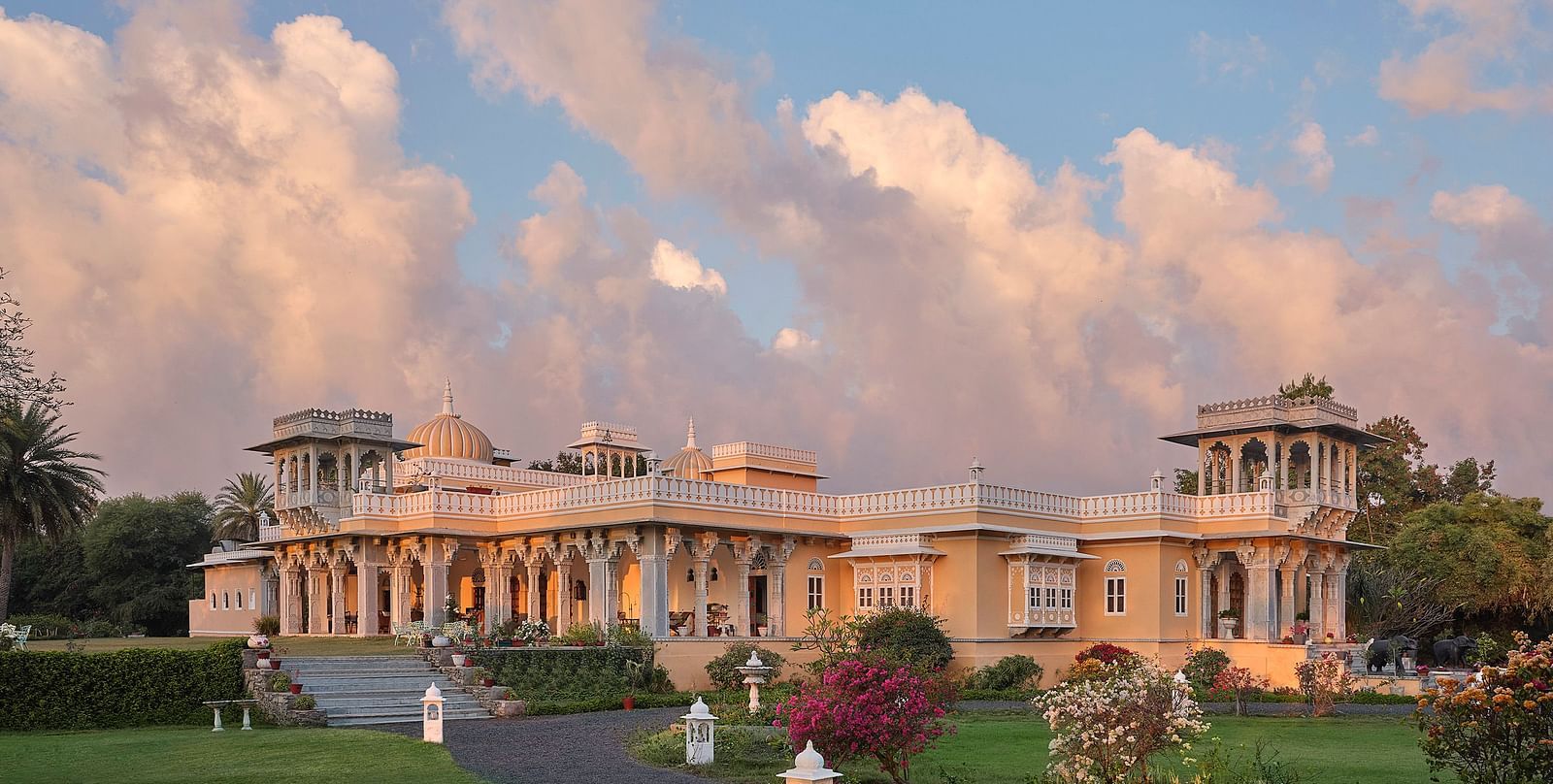 facade image of dev shree, deogarh with a picturesque sky with clouds in the background