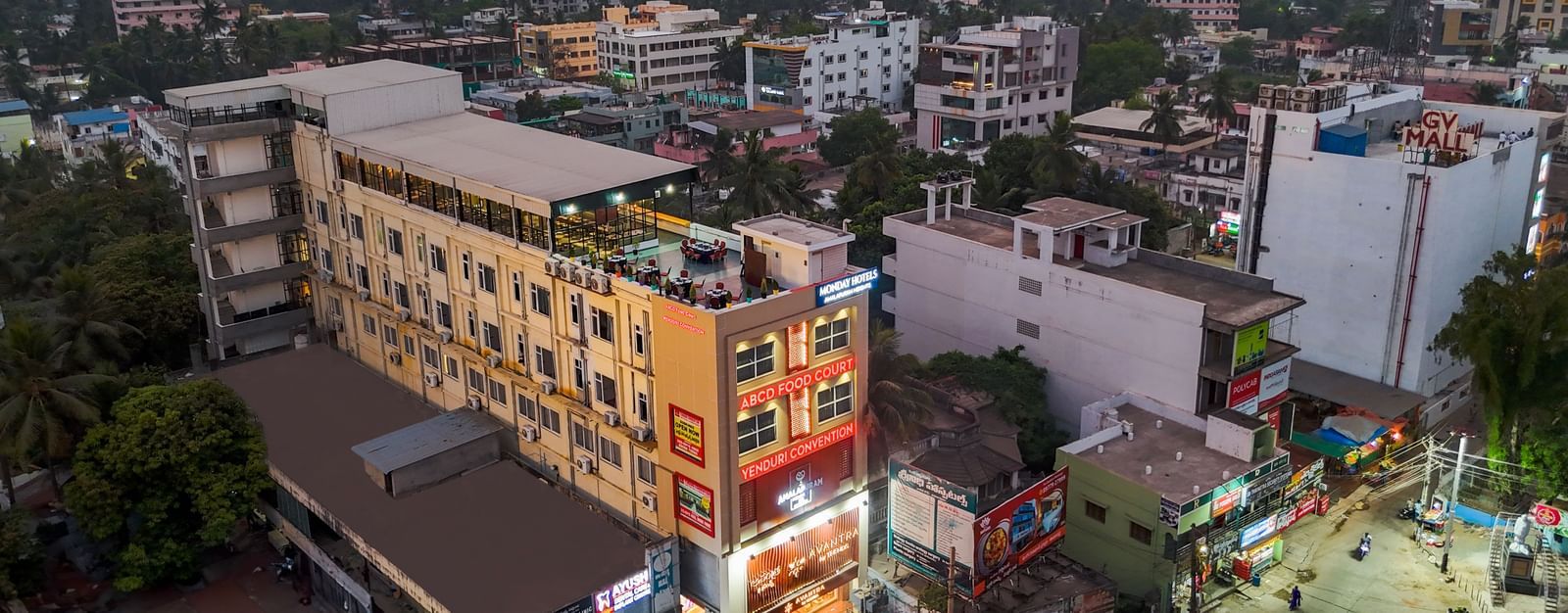 City skyline featuring aerial view of Monday Hotels Amalapuram Heights.