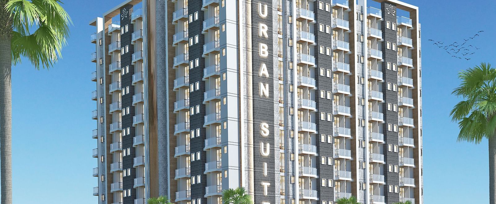 Facade view of Urban Suites by BluSalzz, Jaipur against the sky, with tree leaves framing the foreground.
