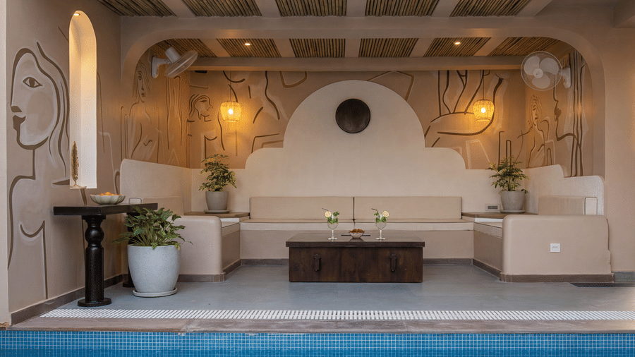 A patio at The Sierra - By The Lake featuring a cushioned outdoor sofa seating area, a central coffee table, and a private plunge pool.