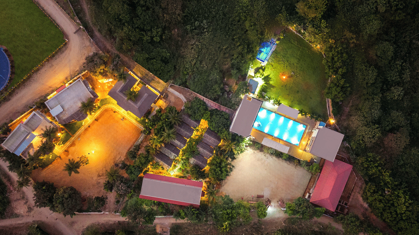 Clear top-down aerial view of the resort property, including the pool, courtyard, and building - 