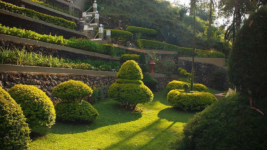 Abad Copper Castle exterior view emphasising the surrounding greenery.