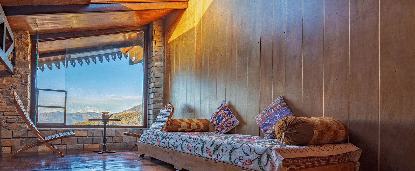 A wide-angle shot of the snow-covered Himalayan mountain range under a deep blue sky. - Blusalzz Homes The Himalayan Bungalow, Almora