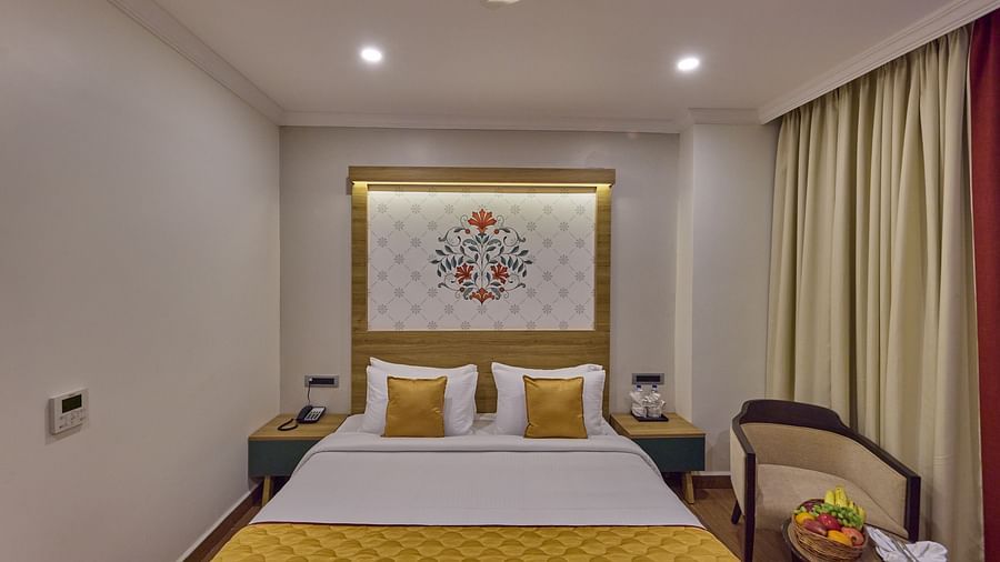 front view of the king size bed offered at the suite - Golden Tulip, Tirupati