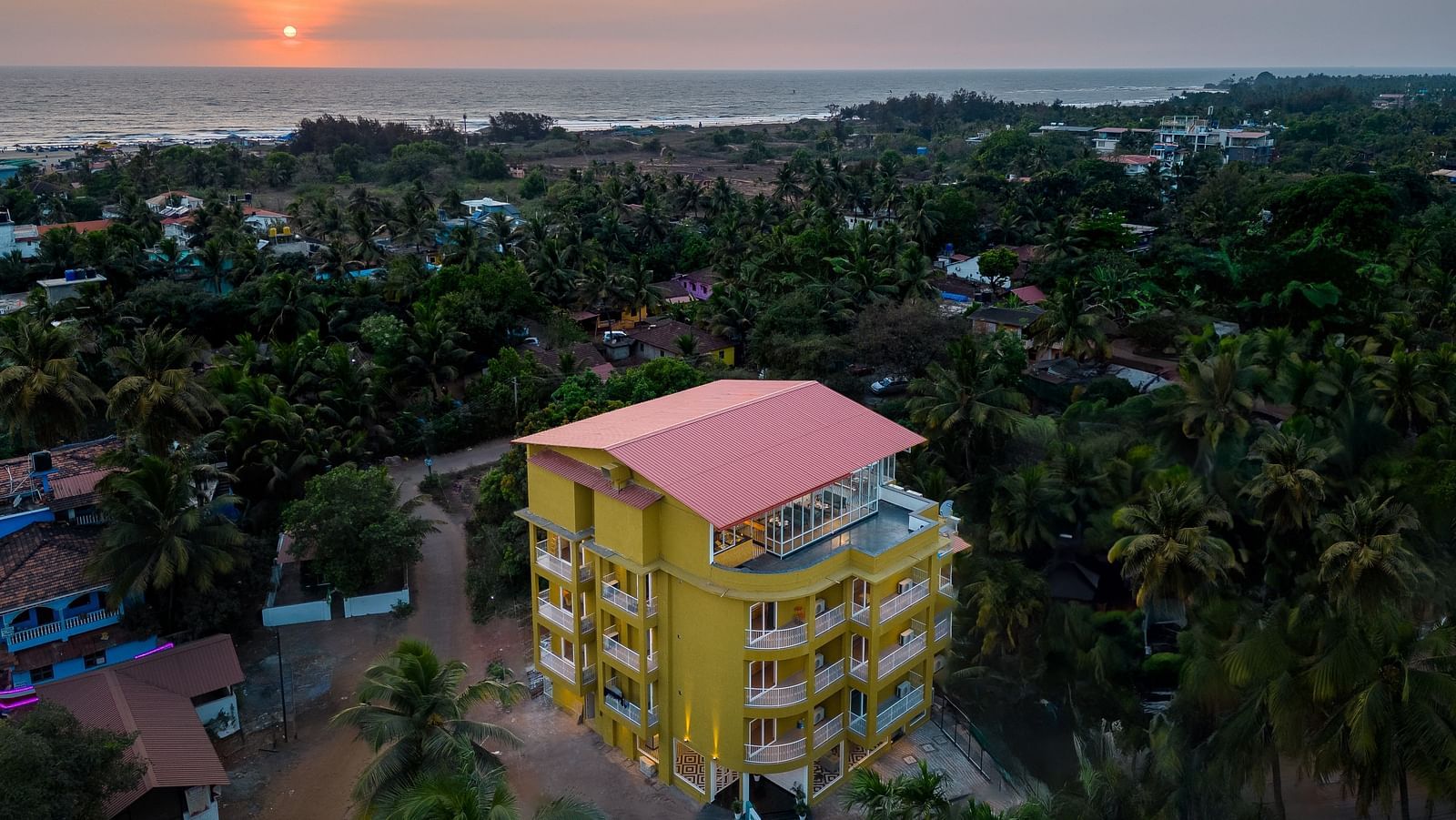 An aerial view image of a facade surrounded by trees - Bedzzz Xclusiv Morjim, Goa