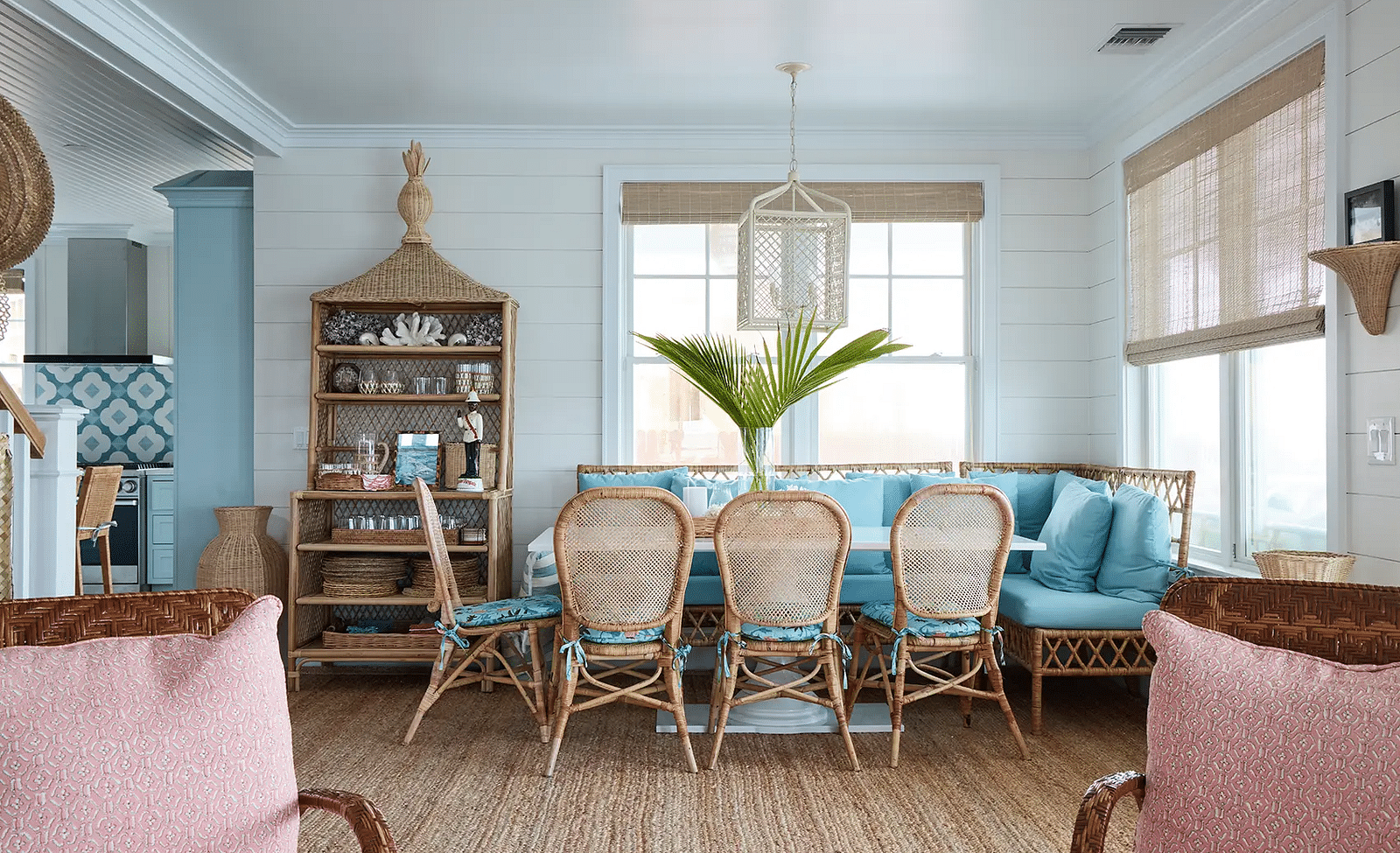 Dining area with a wooden table, wicker chairs, and coastal decor | Abaco Inn