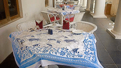 Elegant dining area with a neatly set table and chairs, featured in Tranquebar hotel photos.