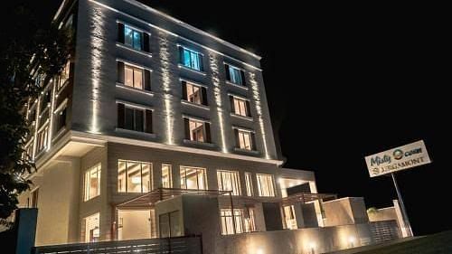 facade image of Misty Ocean, Pondicherry at night 