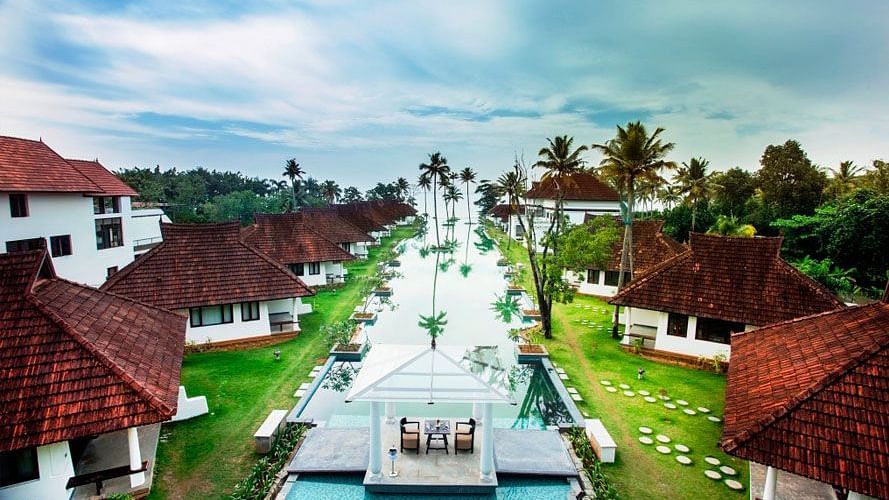 a Bird's Eye View of Rhythm Kumarakom with trees, swimming pool and room in view