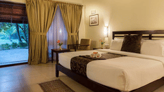 A well-furnished hotel room in Abad Turtle Resort, Marari Alleppey, an Alappuzha beach resort featuring a neatly made double bed