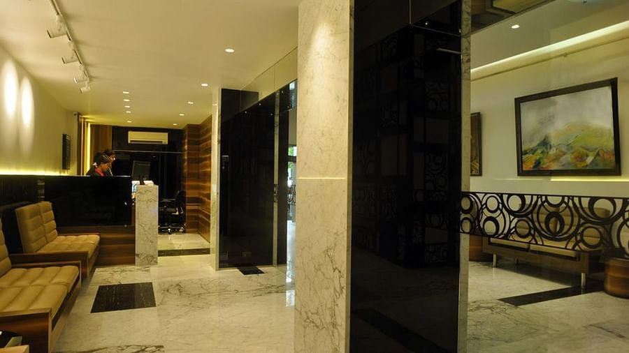 a corridor with sofas at Hotel Diplomat