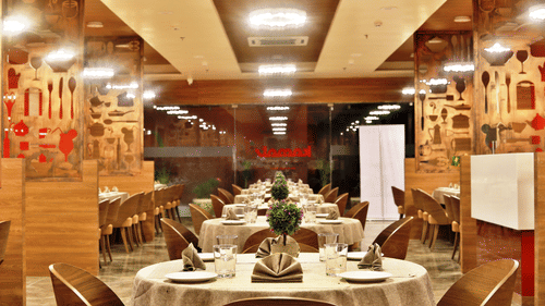 Seating arrangements inside the Restaurant with modern interiors - VITS Devbhumi, Dwarka