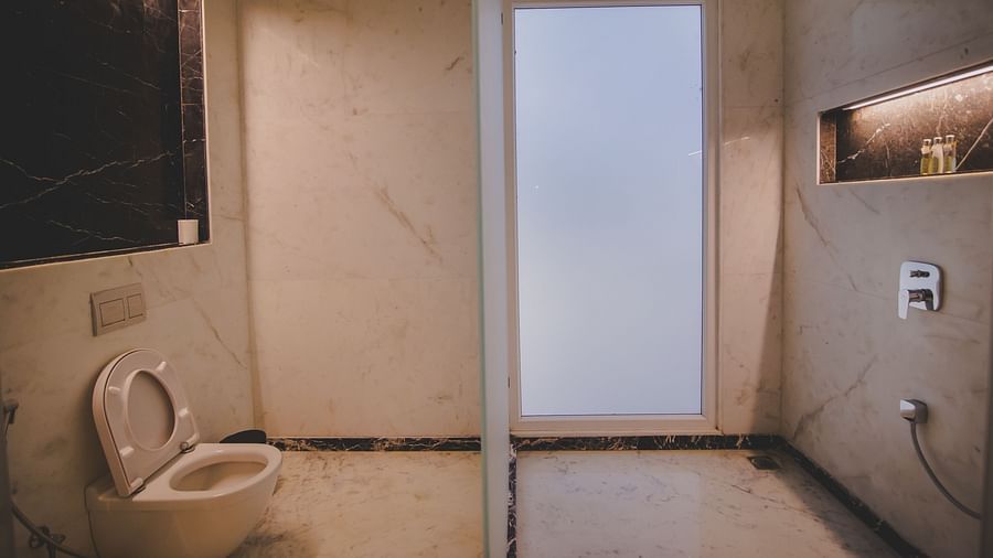 Image of a washroom with a toilet at Rajasthali Resort & Spa Jaipur.