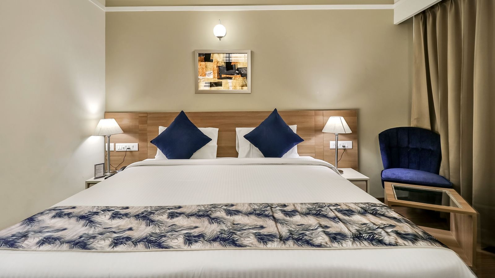 A double bed inside Deluxe Suite - Starlit Suites Newtown, Kolkata