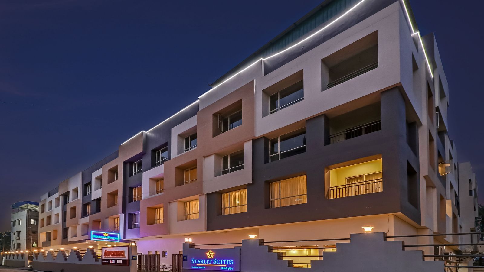 Facade image of Starlit Suites Newtown  Kolkata in the night