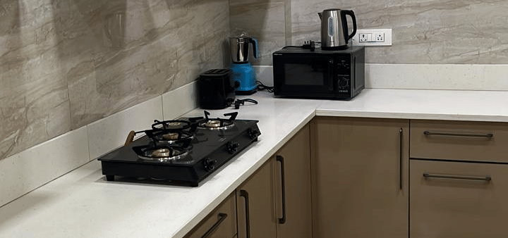 Kitchen area at Lime Tree 3BHK Serviced Apartments, DLF Phase - 5 Gurgaon