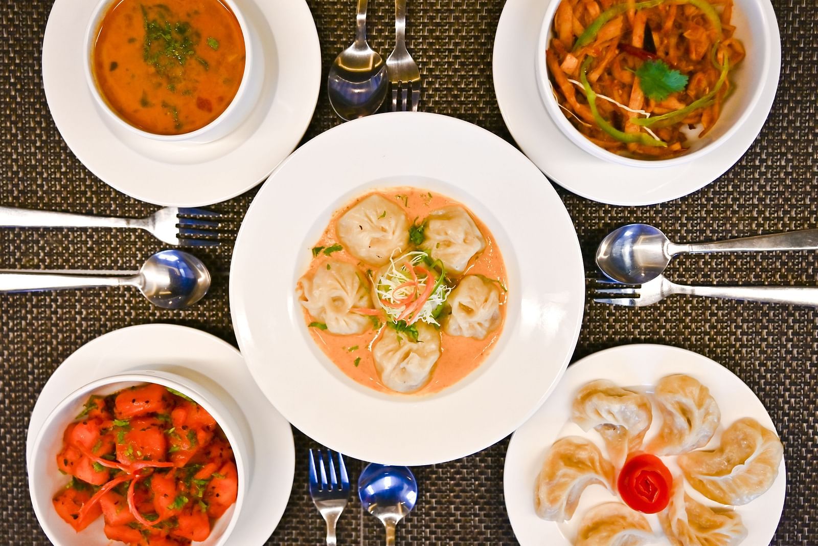 Variety of dishes set on the tables at The Soma Hotel by Avianna Group, Darjeeling