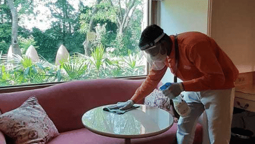 heritage staff santising the resort