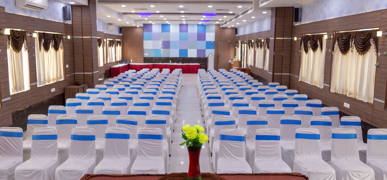 a banquet hall with a classroom style seating arrangement - Hotel Rockfort View, Trichy