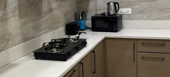 Kitchen area at Lime Tree 3BHK Serviced Apartments, DLF Phase - 5 Gurgaon