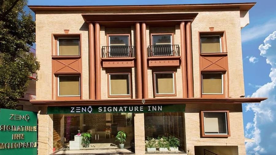facade image of the ZENQ SIGNATURE INN, MCLEODGANJ with a beutiful blue sky in the background