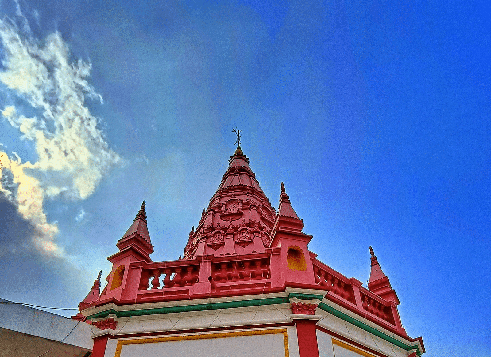 The top of a temple structure against the sky