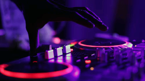 A close up shot of a turntable of a DJ using to play music at a party.