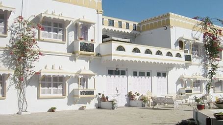 A facade image of Garden Palace Heritage Homestays during a sunny day