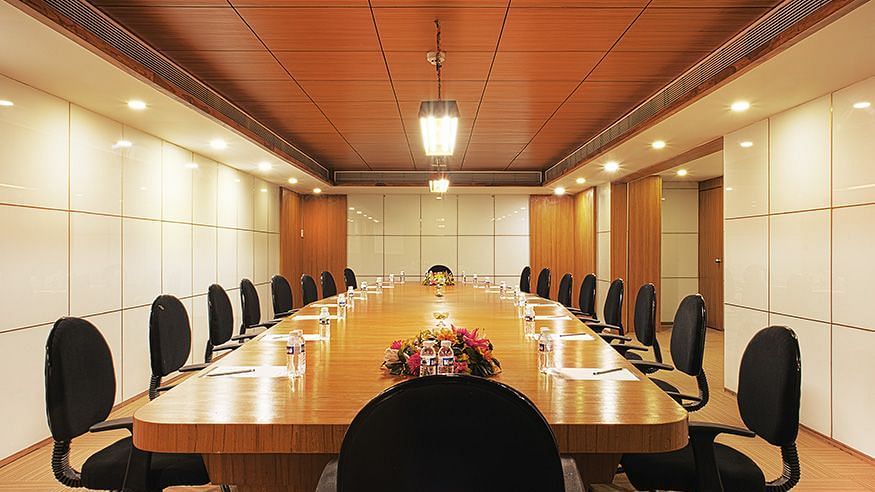 A rectangle table with chairs in the Manthan Board Room - VITS Select, Rajkot.
