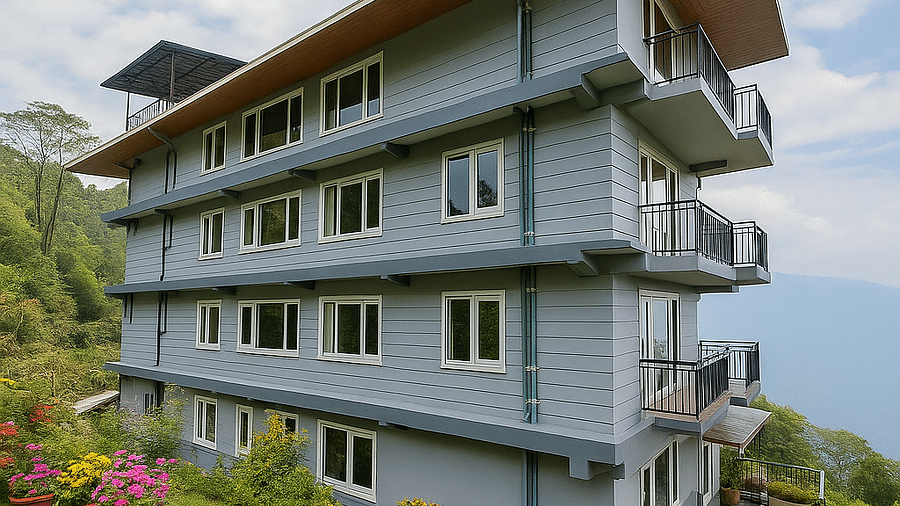  The Summit Enigma Resort & Spa, a multi-story building with balconies, stands on a hillside, surrounded by lush green lawns and colourful potted flowers.   Sources