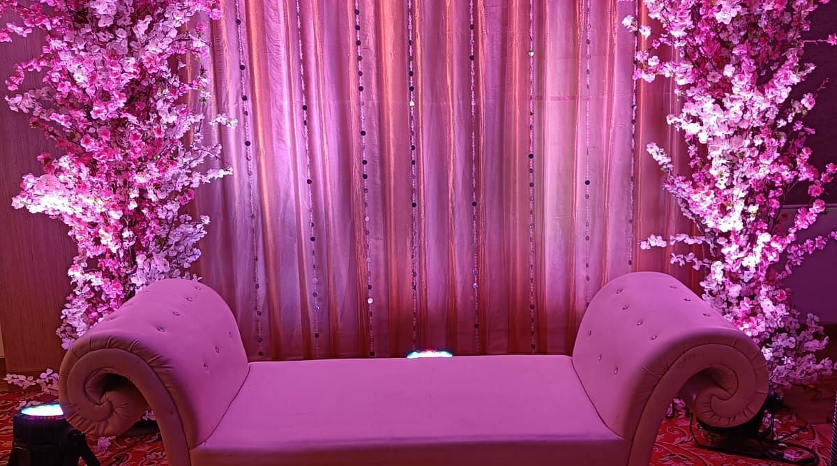 Image of a stage with sofa and dim lights at The Oriental Residency