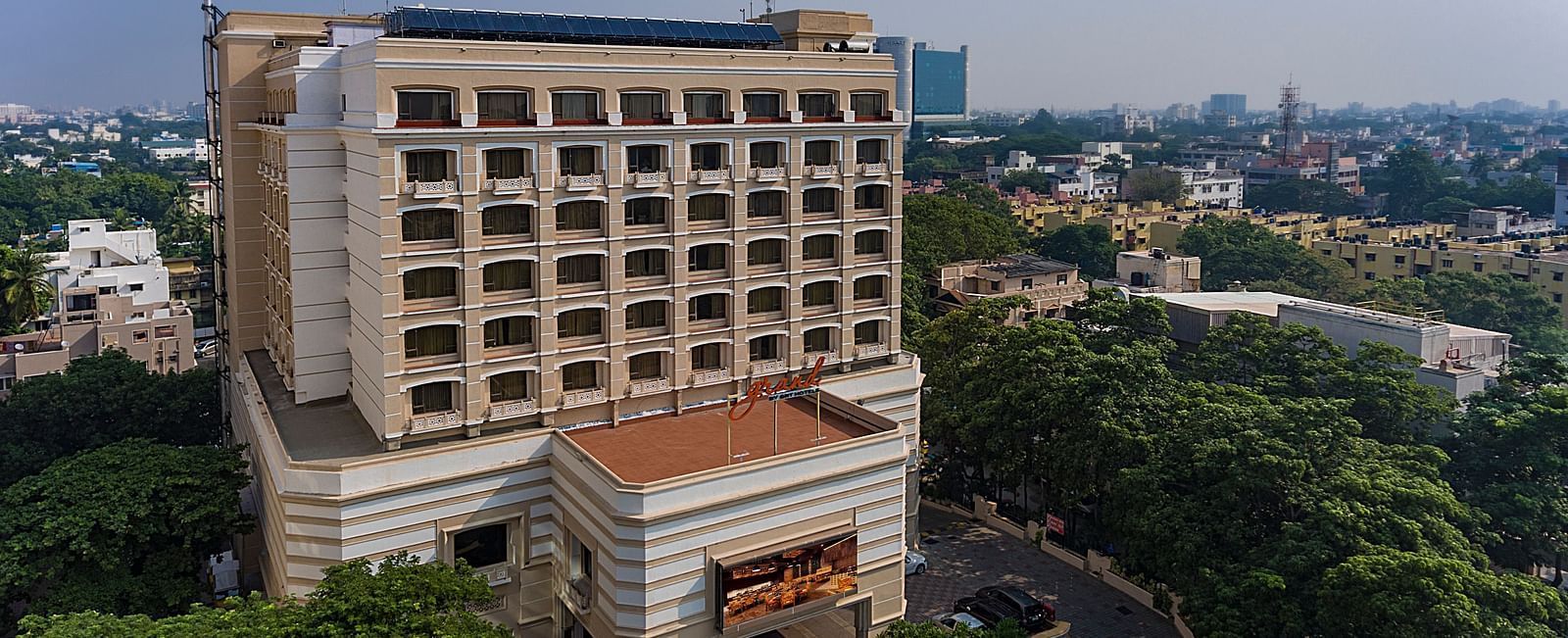 Facade view of Grand Chennai By GRT Hotels during day time.