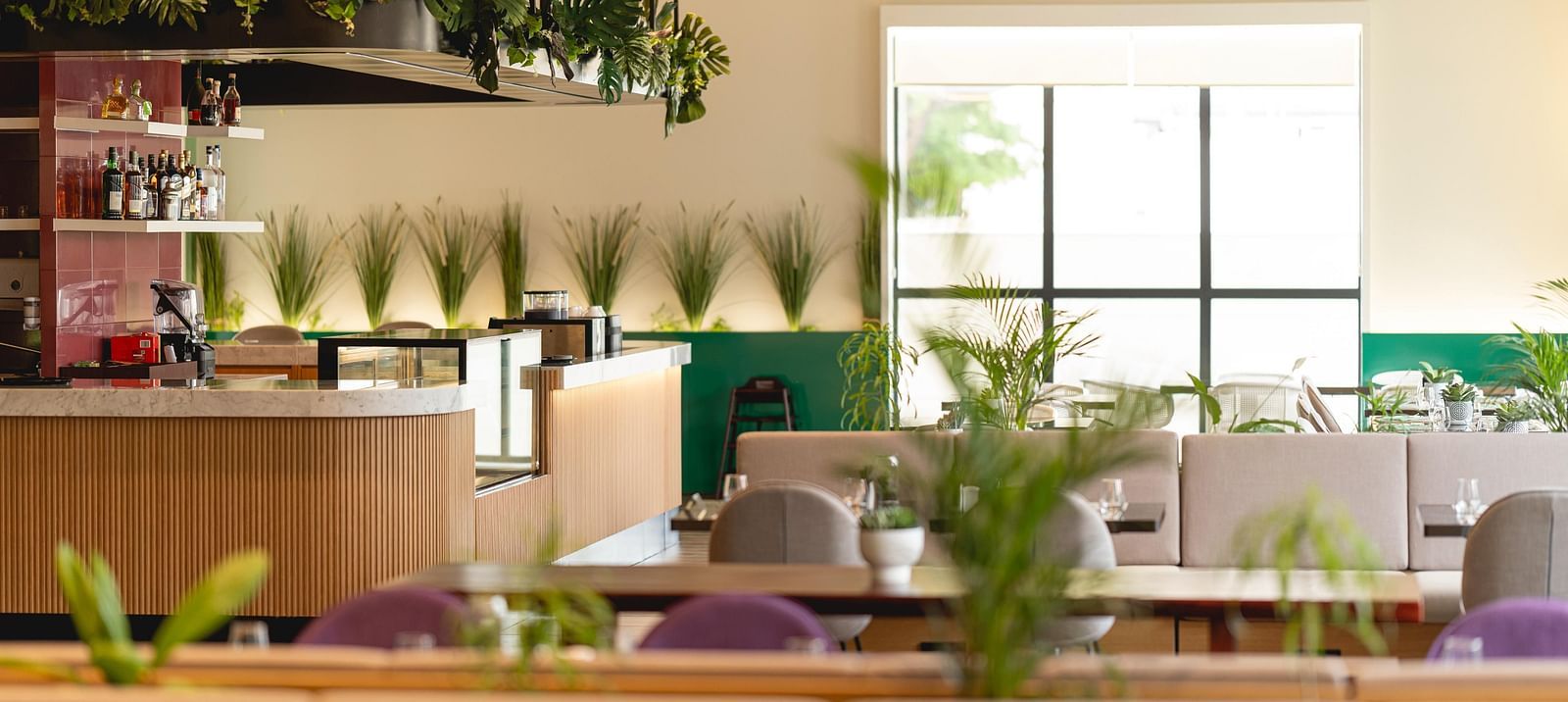 Meli-Melo Restaurant at KertelSuites, featuring elegant seating arrangements and stylish ceiling lights