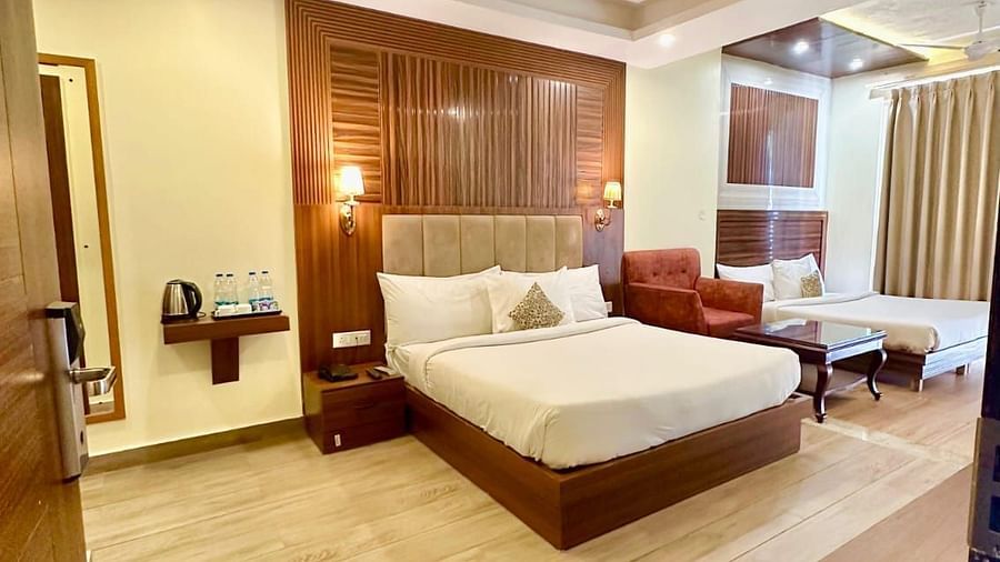 image of the family room featuring a spacious room with plush modern interiors with two double beds - ZENQ SIGNATURE INN, MCLEODGANJ