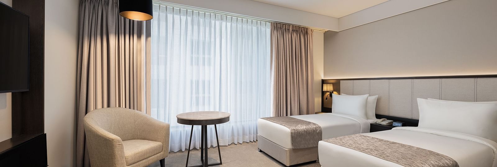 Deluxe Twin Room with twin beds at Essentia Premiere, Pune. 
