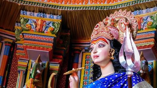 An overview of the idol of a goddess wearing a blue saree - Ramgarh Bungalows, Nainital.