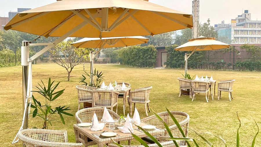 An image of the outdoor event space with seating arrangement - Hideaway banquets & Lawns, Greater Noida