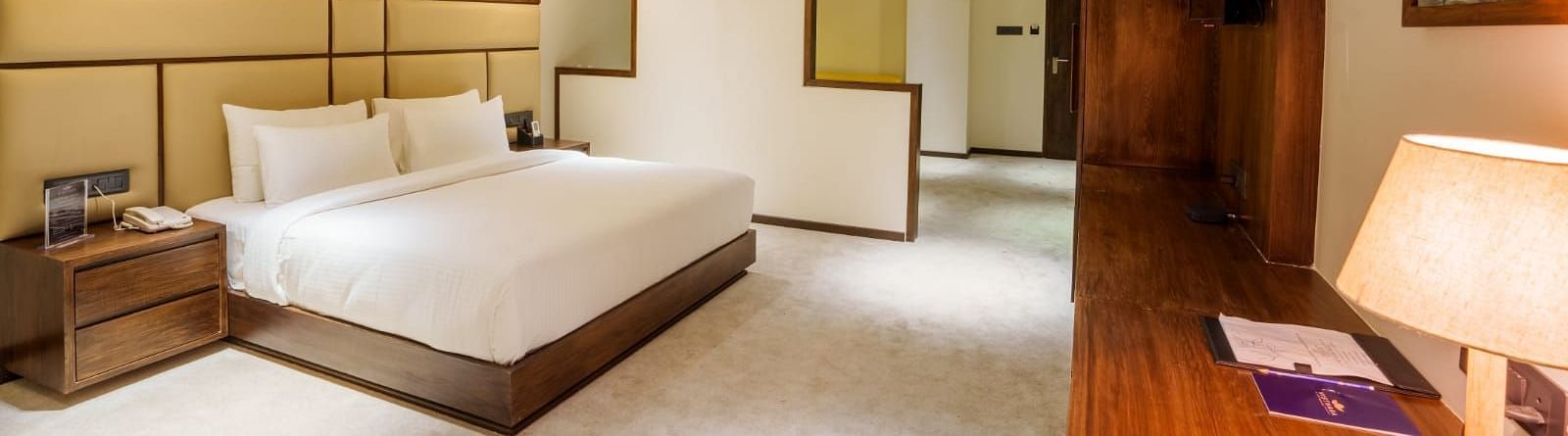 Image of a double bed at the Suite at Visthara - Urban Boutique Hotel
